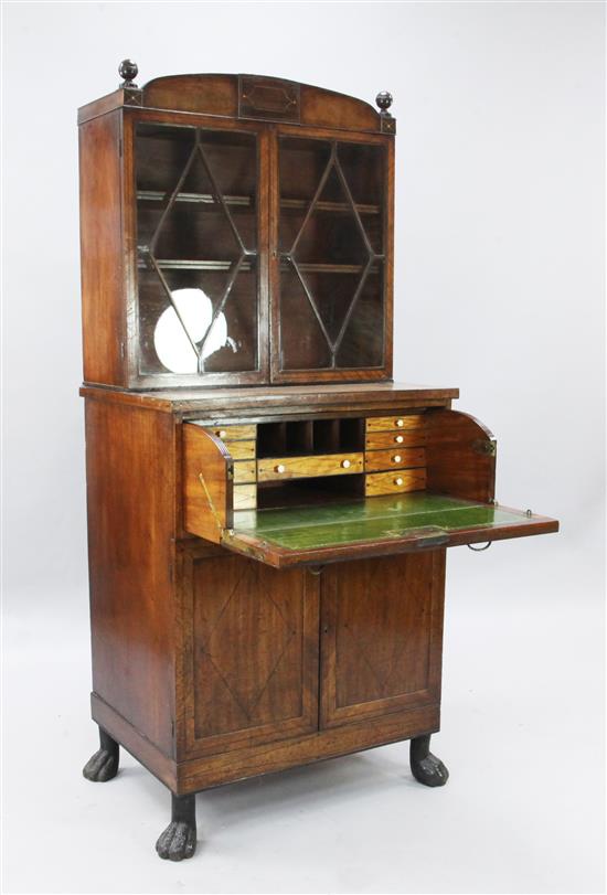A Regency ebony and boxwood strung mahogany domed top secretaire cabinet, W. 2ft 5in. D. 1ft 8in. H. 5ft 6in.
